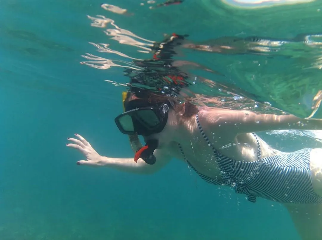 Guest snorkeling underwater on the shared Angel Rock trip, Trincomalee