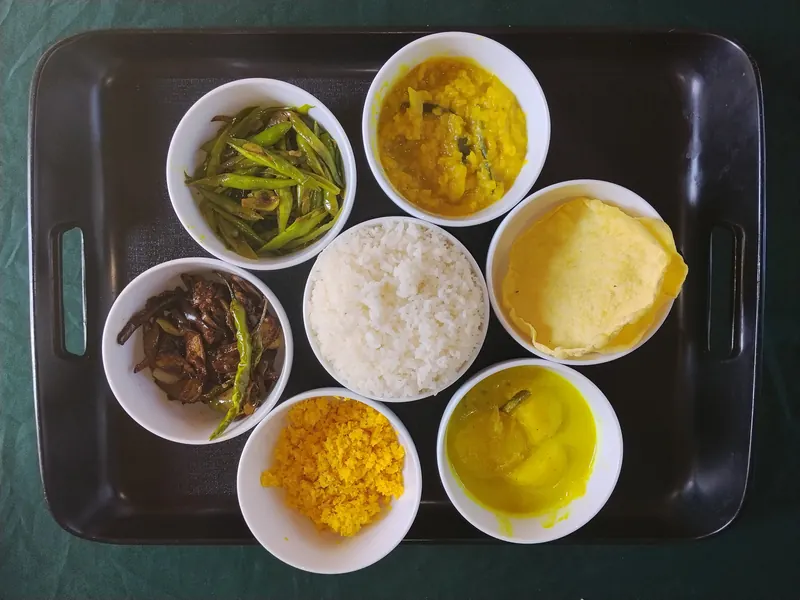 Rice and curry set served in bowls on a tray